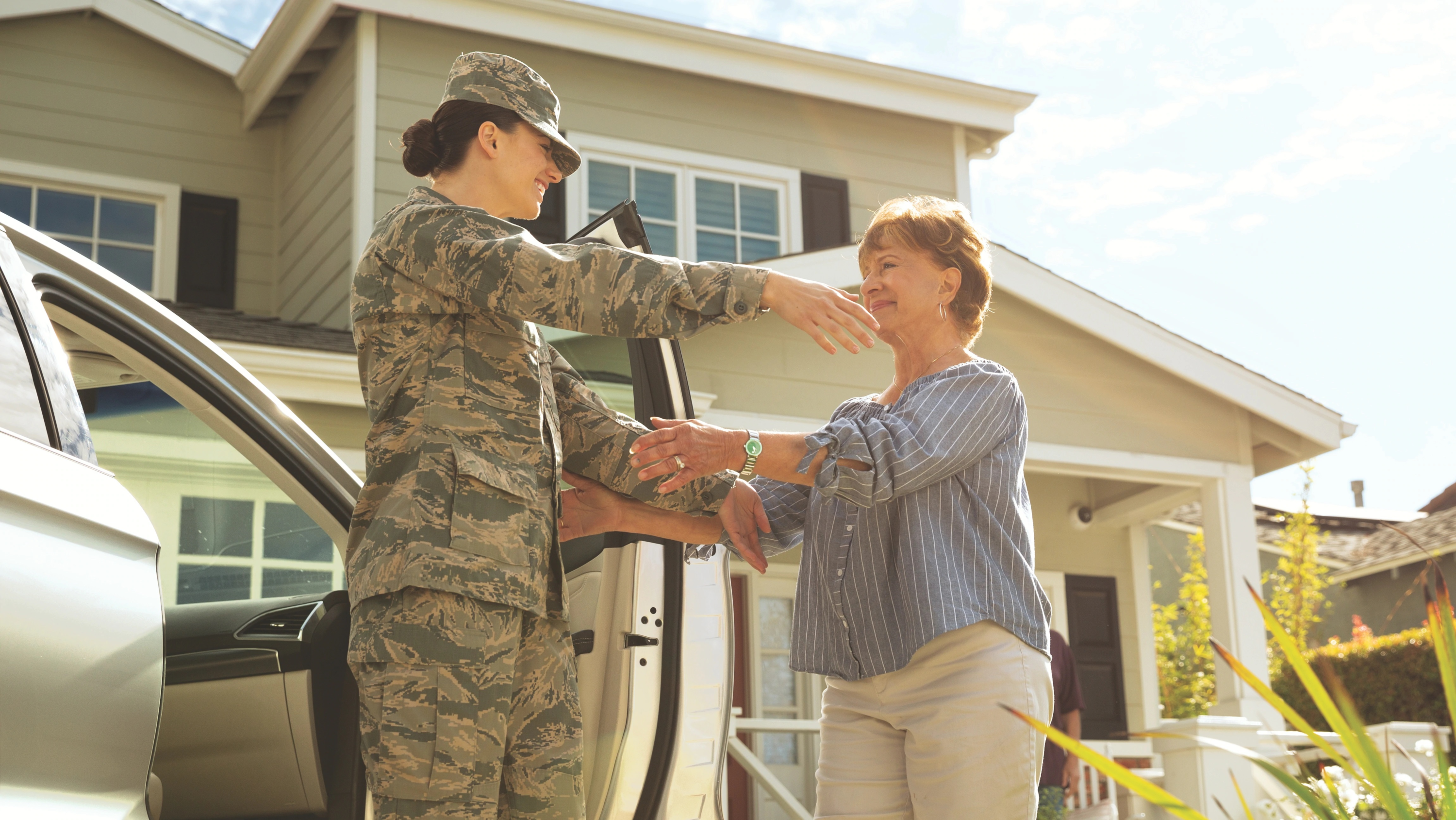 Enterprise military member greets woman